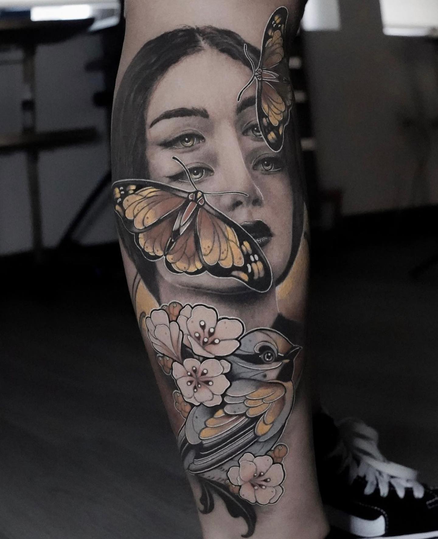 woman and butterfly tattoo