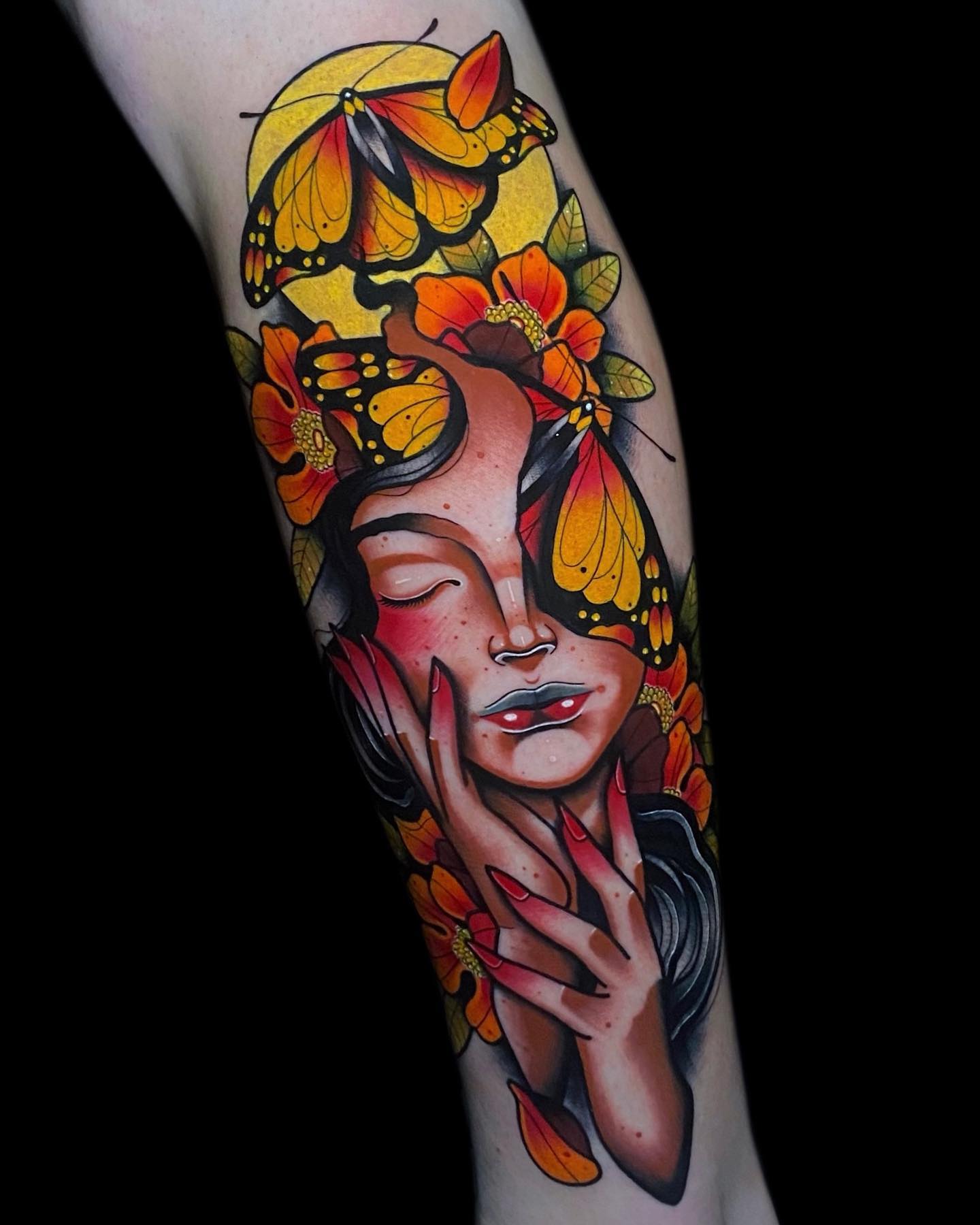 woman orange butterfly tattoo