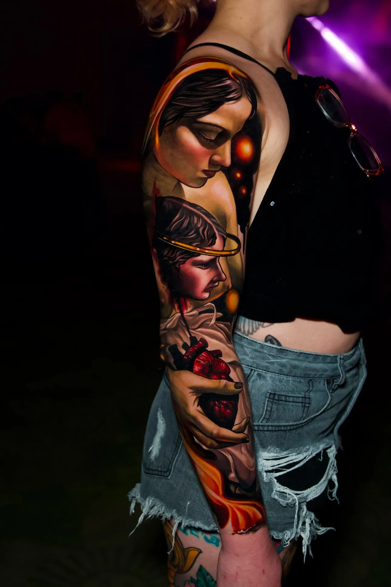 Full sleeve color realism tattoo with religious portraits on female arm at Inknation Studio NYC