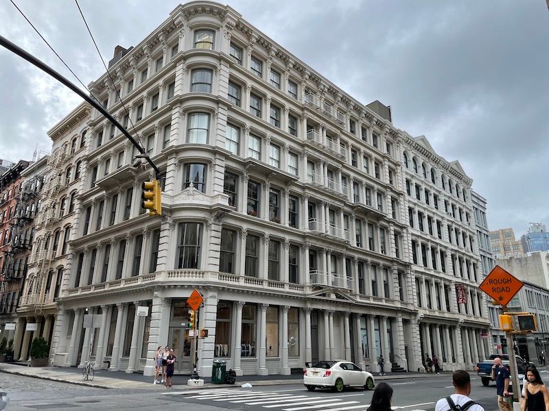 Cast-iron building at a street corner in SoHo, Manhattan, NYC