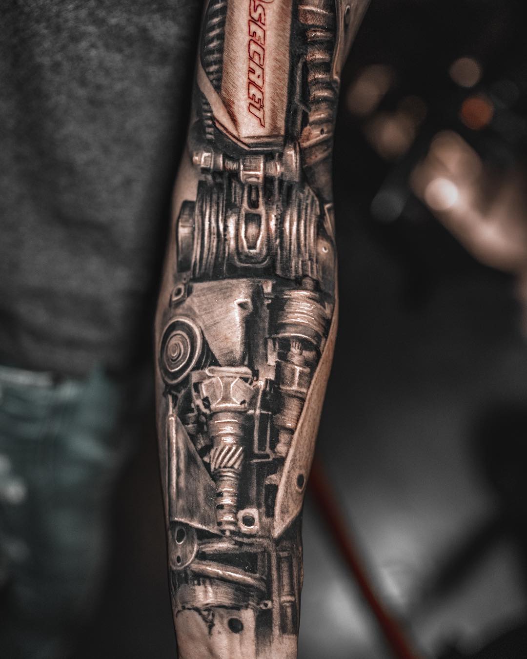 black grey biomechanical forearm pistons cables tattoo inknation tattoo by Inknation Studio NYC.realism-tattoo-arm