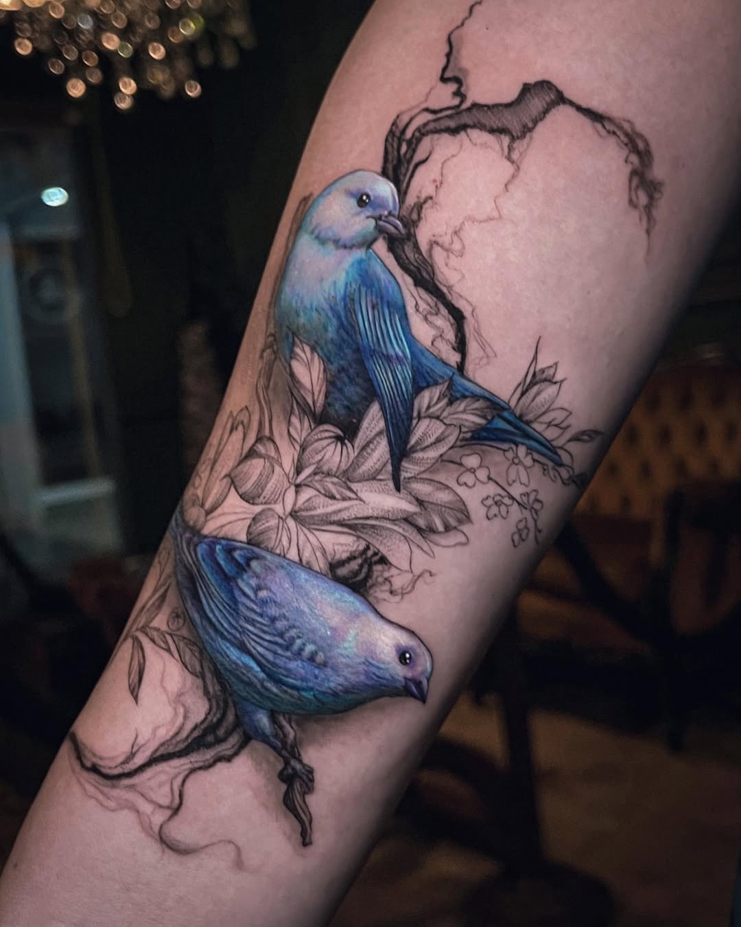 Color realism blue birds forearm tattoo with heart background, freedom symbolism, Inknation Studio NYC