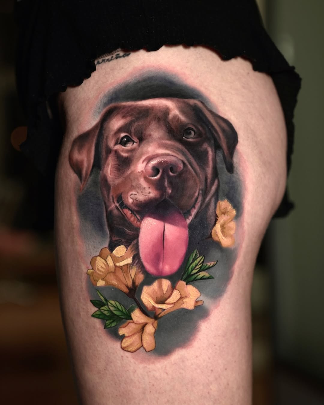 Color realism chocolate labrador thigh tattoo with roses, loyalty symbolism, Inknation Studio NYC