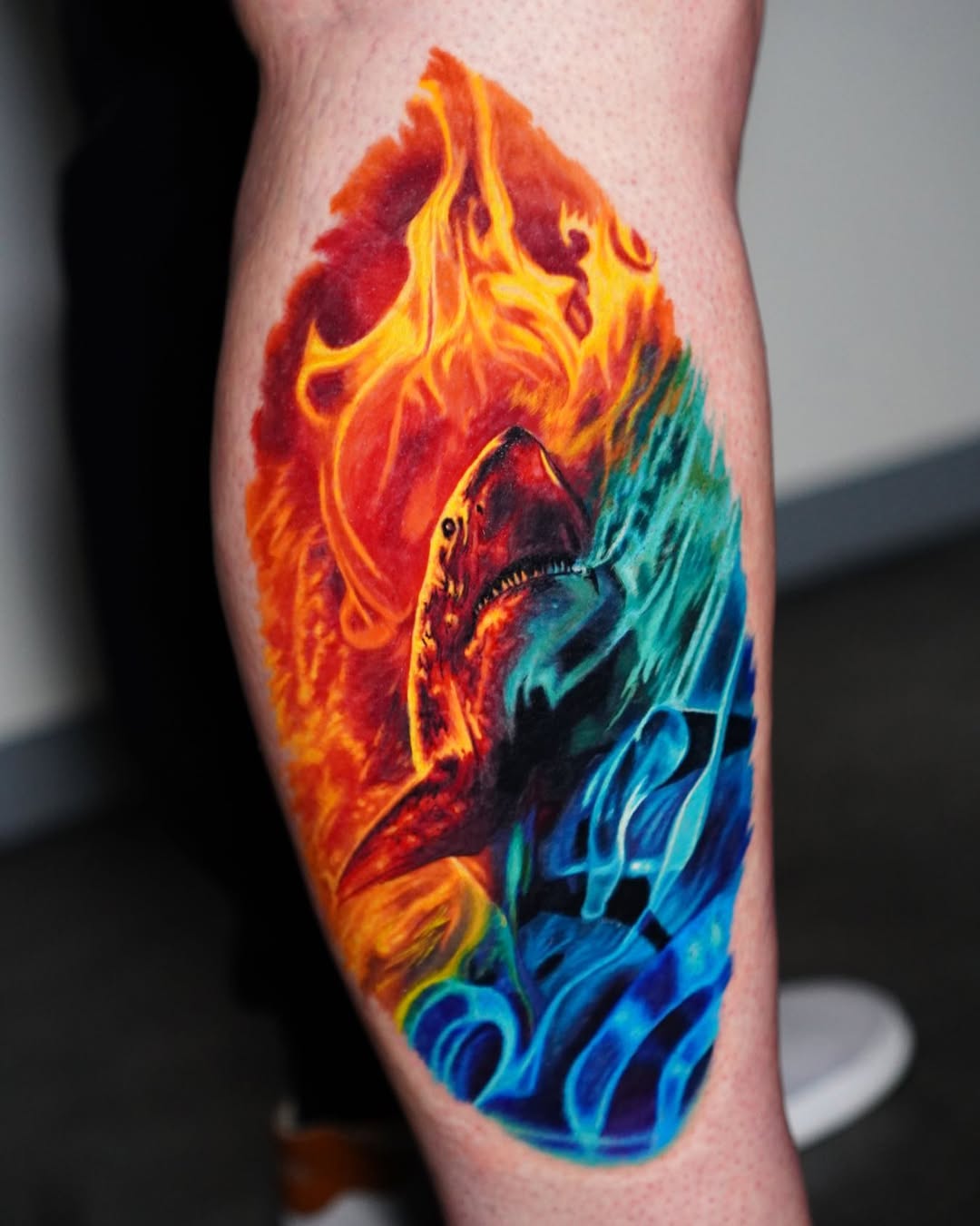 Color realism great white shark tattoo with flames on forearm, fiery gradient, Inknation Studio
