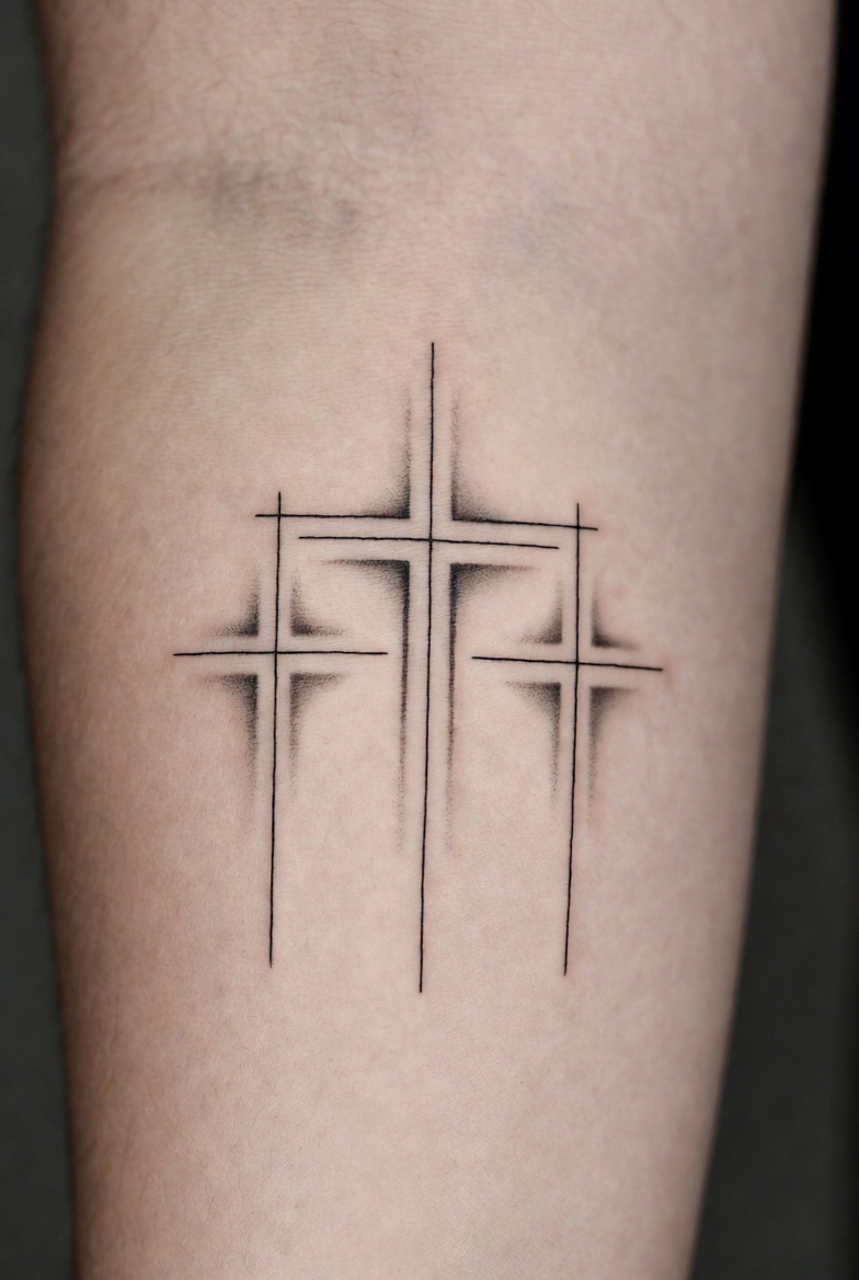 Minimalist fine line cross tattoo with geometric shading on forearm, modern abstract design, Inknation Studio NYC