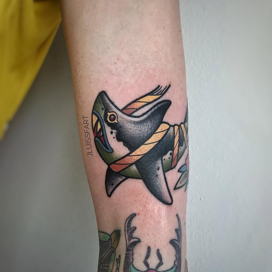 Traditional shark tattoo on forearm with colorful old-school style and open jaws, Inknation Studio
