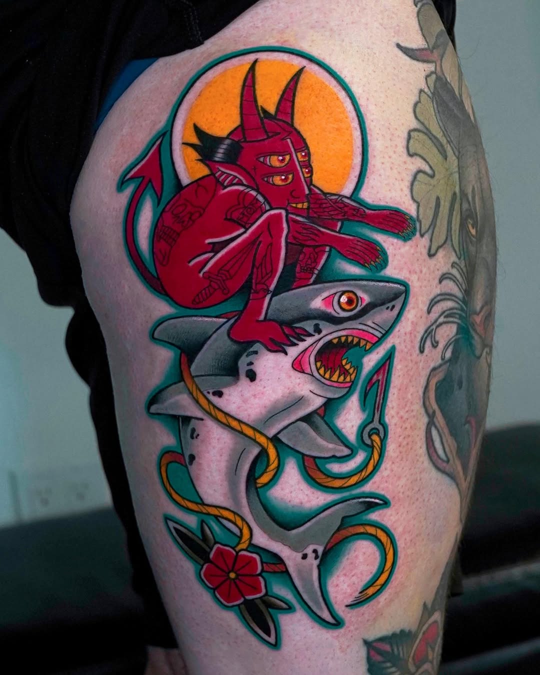 Traditional devil riding shark tattoo on forearm, colorful illustrative style, Inknation Studio