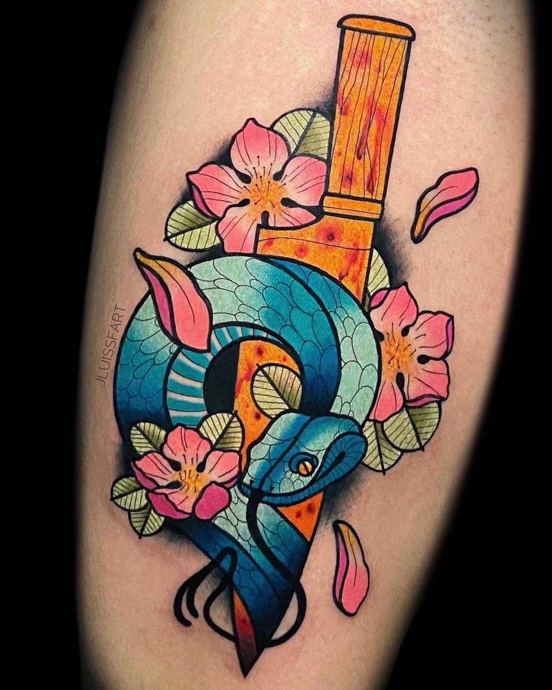 Traditional Japanese snake tattoo with bamboo and cherry blossoms on upper arm, Inknation Studio NYC