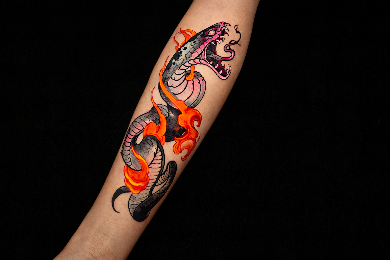 Traditional Japanese snake tattoo on forearm with flames and open mouth, Inknation Studio NYC